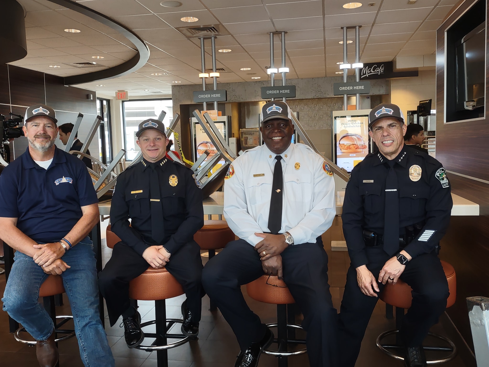 100 Club of Central Texas Executive Director Grahame Jones with Austin EMS, Fire, and Police Chiefs at McDonald's Good Friday Fundraiser